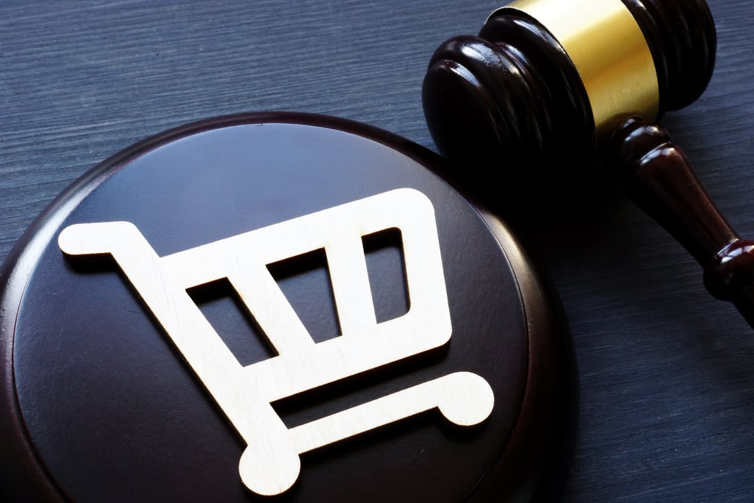 Consumer rights. Shopping cart and gavel.